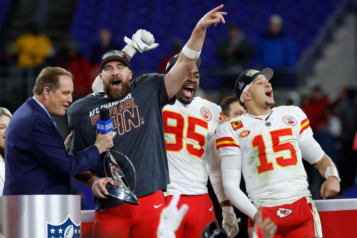 Jim Nantz holds a microphone up to Travis Kelce as Chris Jones, Patrick Mahomes stand next to him